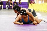 Lemoore's Isaiah Morales, shown here, picked up four wins in the Tigers' 19th Annual Lemoore Duals. The Tigers won three of four matches in the prestigious tourney.